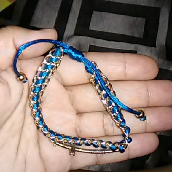 Jewelry - String bracelet with cross accent